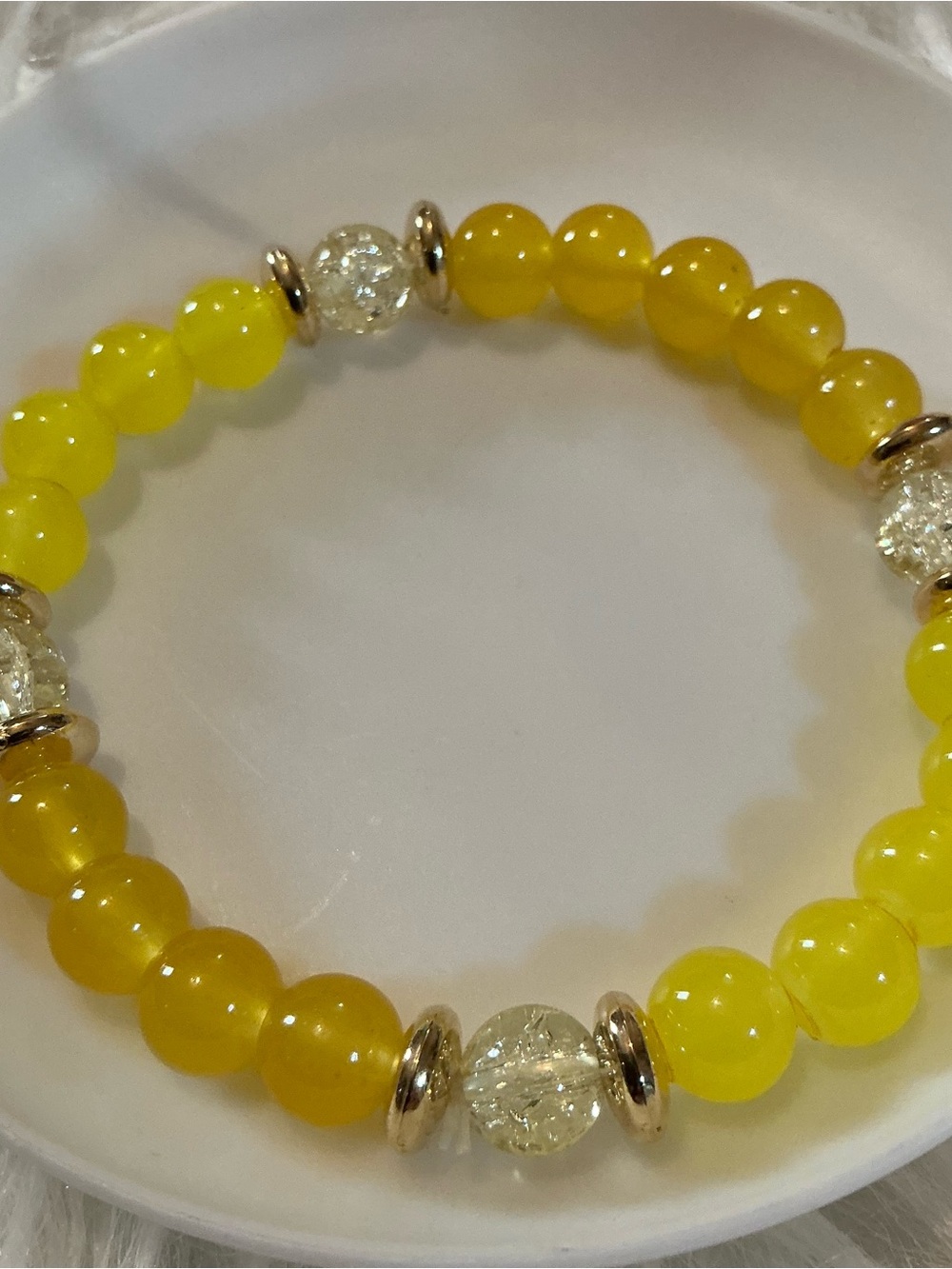 Yellow, gold-tone, clear bead bracelet